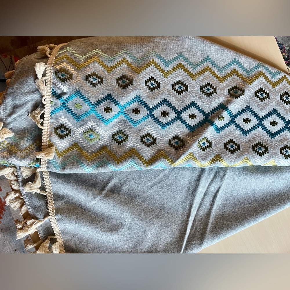 Round Grey/Blue Embroidered Table cloth with fringe.  Used one, washed.